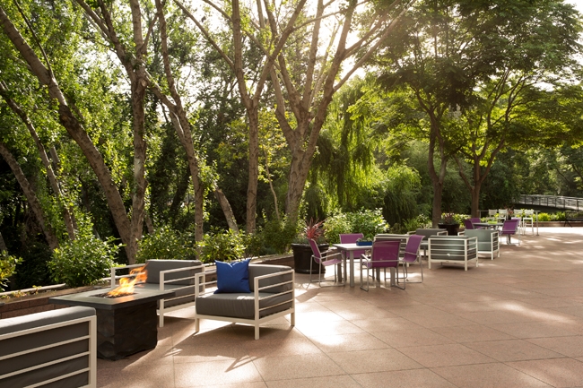 Park-like setting with extensively-landscaped gardens, walkways, fountain and outdoor seating areas